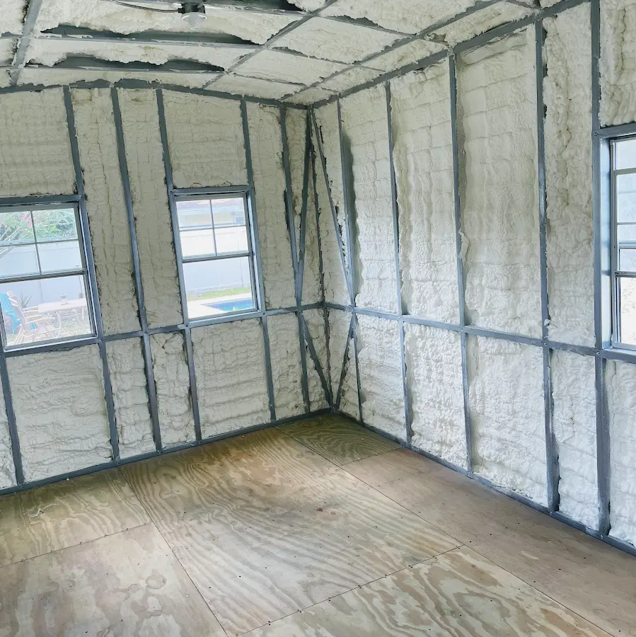 Closed-cell spray foam insulation applied to wall cavities in a residential project in West Melbourne